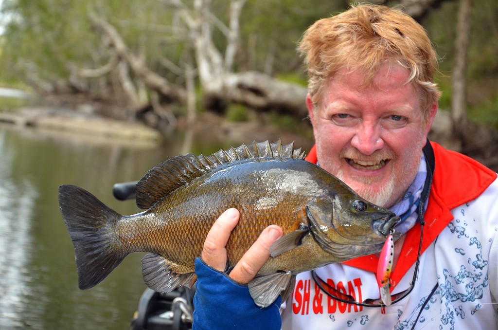 Graham Brake with a nice little Central Queensland sooty grunter.  This fish smashed a prototype Reidy's Little Lucifer near a rocky ledge. © Lee Brake